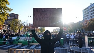 Student in front of the Helene Boucher high School during a protest against under-resourced schools, in Paris, Thursday Oct. 8, 2026. 