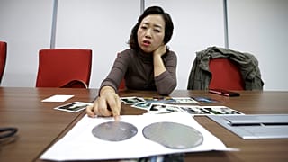 FILE. Samsung chip worker explains how silicon wafers are used in the semiconductor process during an interview in Seoul, South Korea, March 2016