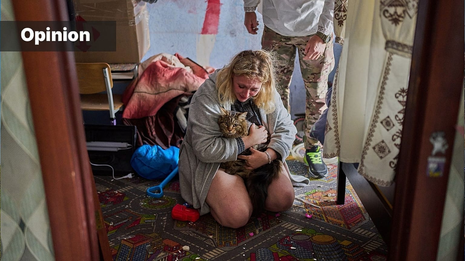 Liudmyla and Leonid Ryzhak found their lost cat in their damaged apartment following a Russian missile and drone attack in Kyiv, Ukraine, 2026 (AP Photo/Francisco Seco)