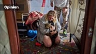 Liudmyla and Leonid Ryzhak found their lost cat in their damaged apartment following a Russian missile and drone attack in Kyiv, Ukraine, 2026 (AP Photo/Francisco Seco)