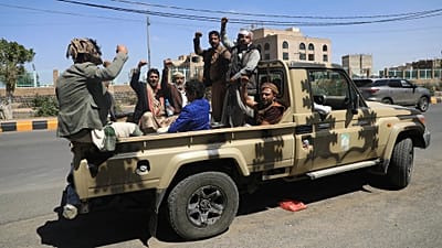 FILE: Houthi supporters chant slogans while riding in the back of a pickup truck at an armed tribal rally in Sanaa, 7 October 2026