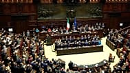 Italian Premier Giorgia Meloni, center, receives an applause as she addresses the lower Chamber ahead of a confidence vote for her Cabinet, Tuesday, Oct. 25, 2022