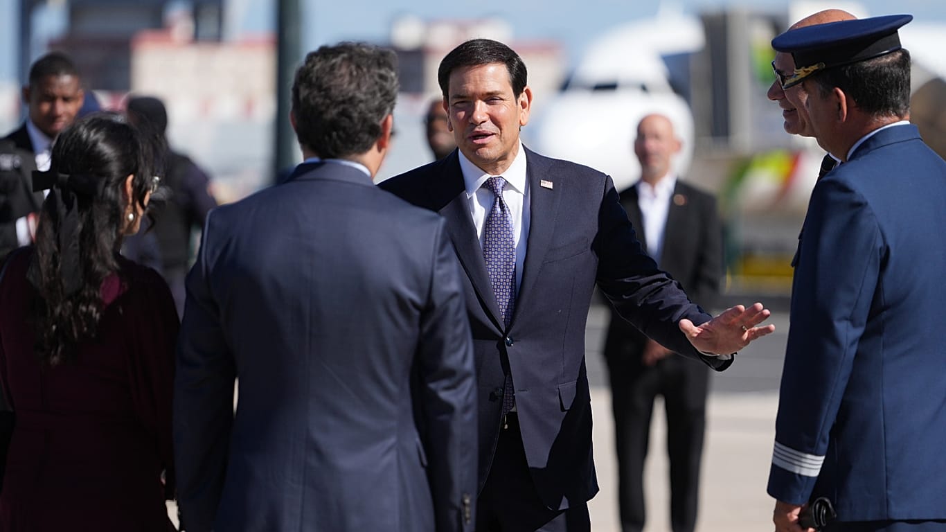 US Secretary of State Marco Rubio talks to the staff before boarding a plane 8 Thursday, Oct., 2026, at Lisbon Airport in Lisbon. 