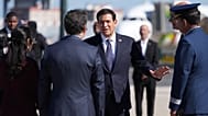 US Secretary of State Marco Rubio talks to the staff before boarding a plane 8 Thursday, Oct., 2026, at Lisbon Airport in Lisbon. 