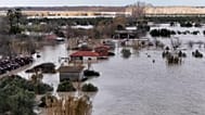 Aerial shot village of Novosela flooded by floodwaters of the Vjosa river
