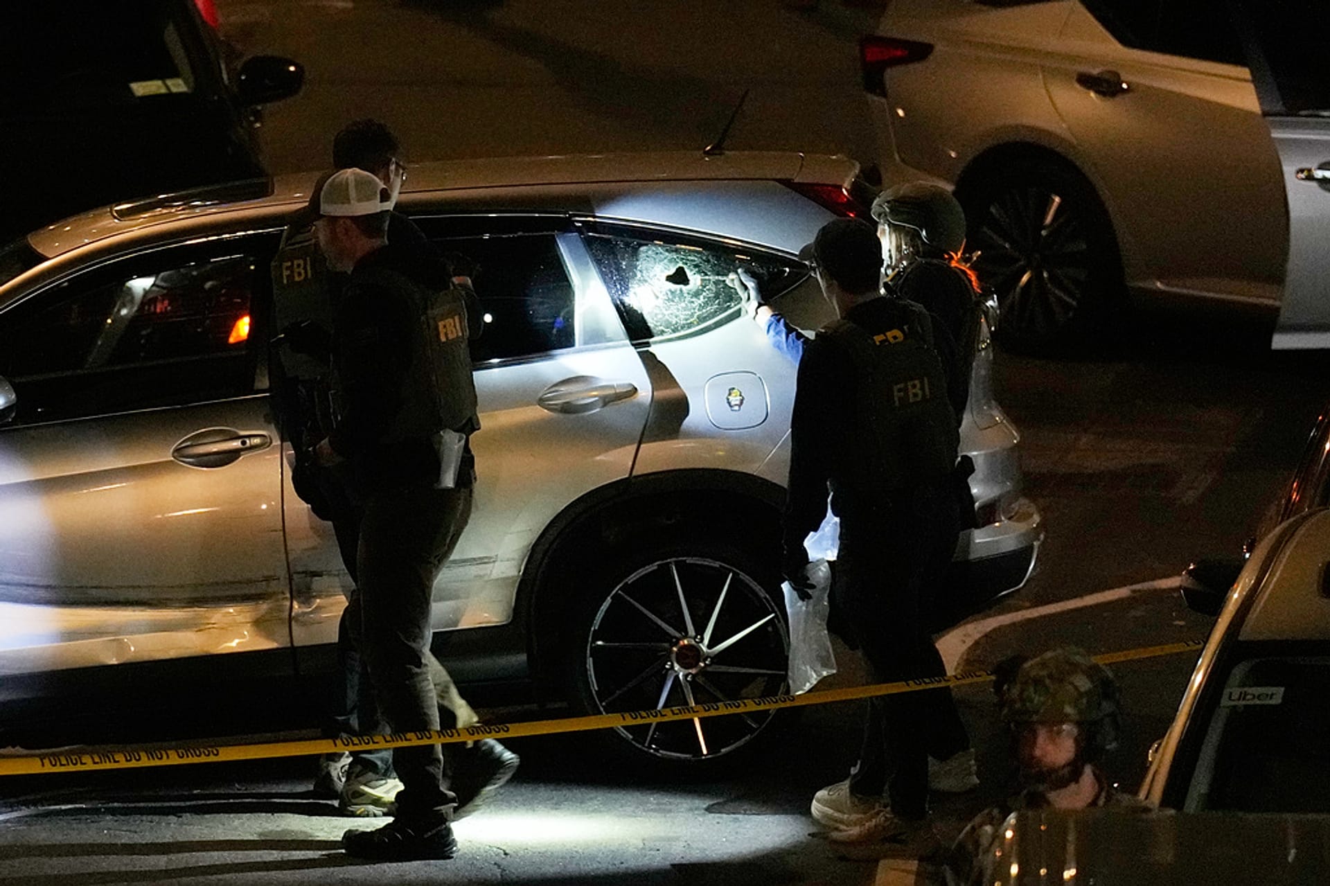 FBI agents perform an investigation at the scene of a shooting on Thursday, Oct. 8, 2026, in New York