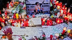 Flowers, candles and farewell messages are placed at a memorial in Madrid, Spain, to honor the memory of Maria del Carmen Abascal.