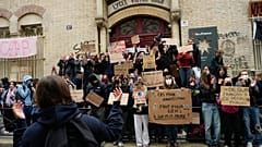 Students stand in front of a blockaded high school as they protest against under-resourced schools, in Paris, Friday, 9 Oct., 2026.