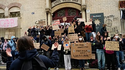 Students stand in front of a blockaded high school as they protest against under-resourced schools, in Paris, Friday, 9 Oct., 2026.