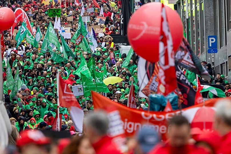 Demonstrators take part in a national protest organized by Belgian trade unions against the government's proposed budget measures in Brussels.