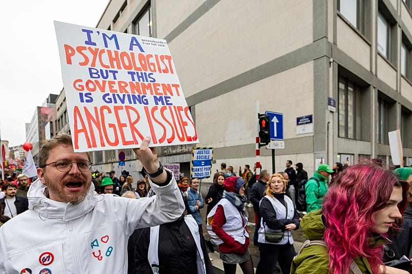 Demonstrators take part in a national protest organized by Belgian trade unions against the government's proposed budget measures in Brussels.
