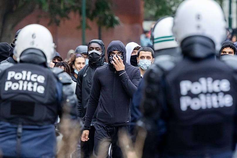 Protesters clash with riot police during a national demonstration against government budget cuts and proposed reforms in Brussels, Belgium, Friday, 9 October 2026.