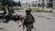 A Ukrainian soldier walks down a street in front-line Druzhkivka (Donetsk region), 12 September 2026.