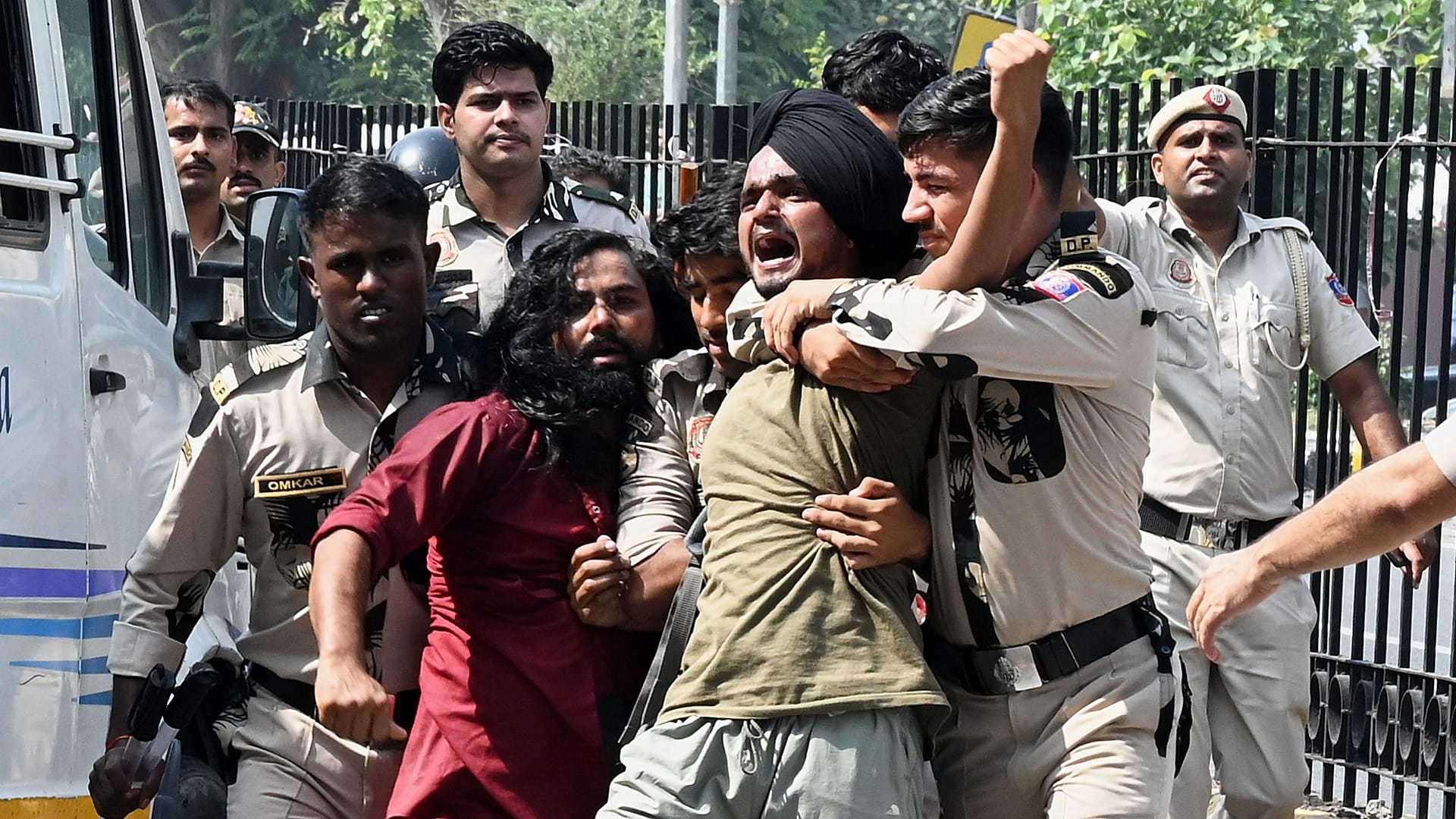 Policemen detain protesters during a youth demonstration demanding the resignation of the country's election chief Gyanesh Kumar, in New Delhi, India, Saturday,