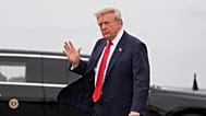 President Donald Trump waves as he arrives on Air Force One, Saturday, Oct. 10, 2026, in Fort Campbell, Ky.