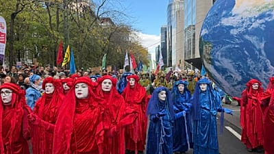 Protesters march in Brussels demanding greater action to combat climate change. Sunday Oct. 10, 2026.