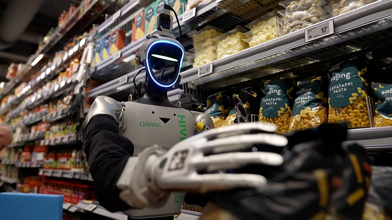 Hive Robots humanoid robot stacking shelves at Føtex grocery store in Denmark