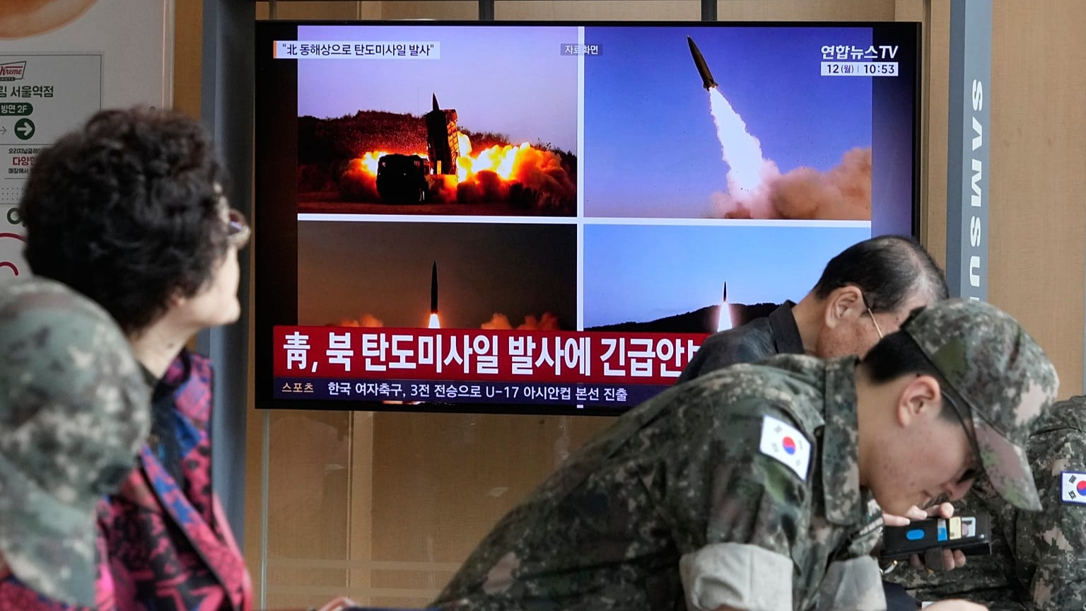 A TV screen shows file images of North Korean missiles launch during a news programme at Seoul Railway Station, 12 October, 2026