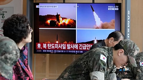 A TV screen shows file images of North Korean missiles launch during a news programme at Seoul Railway Station, 12 October, 2026