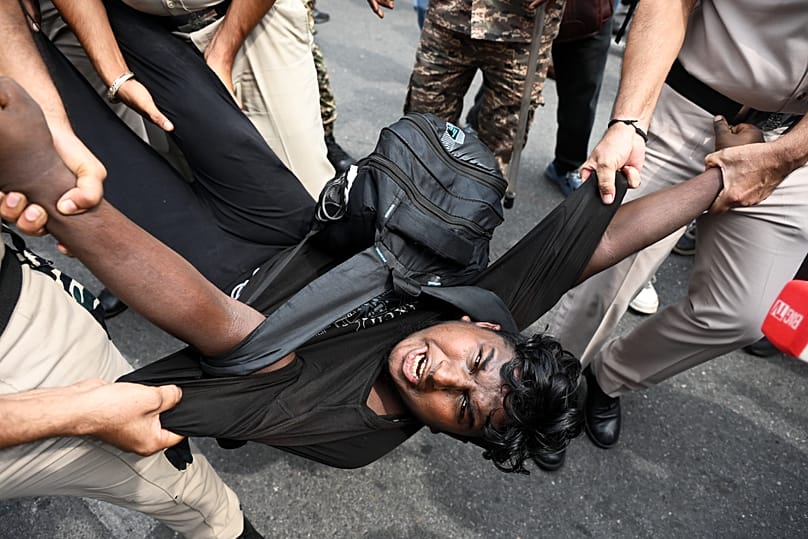 Police detain a protester during a youth demonstration demanding the resignation of the country's election chief in New Delhi, 11 October, 2026