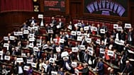 Lawmakers protest as a display shows the results of a vote of the final vote on the electoral law bill at Chamber of Deputies in Rome, Thursday, Oct. 8, 2026