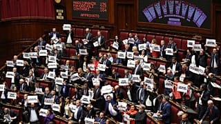 Lawmakers protest as a display shows the results of a vote of the final vote on the electoral law bill at Chamber of Deputies in Rome, Thursday, Oct. 8, 2026