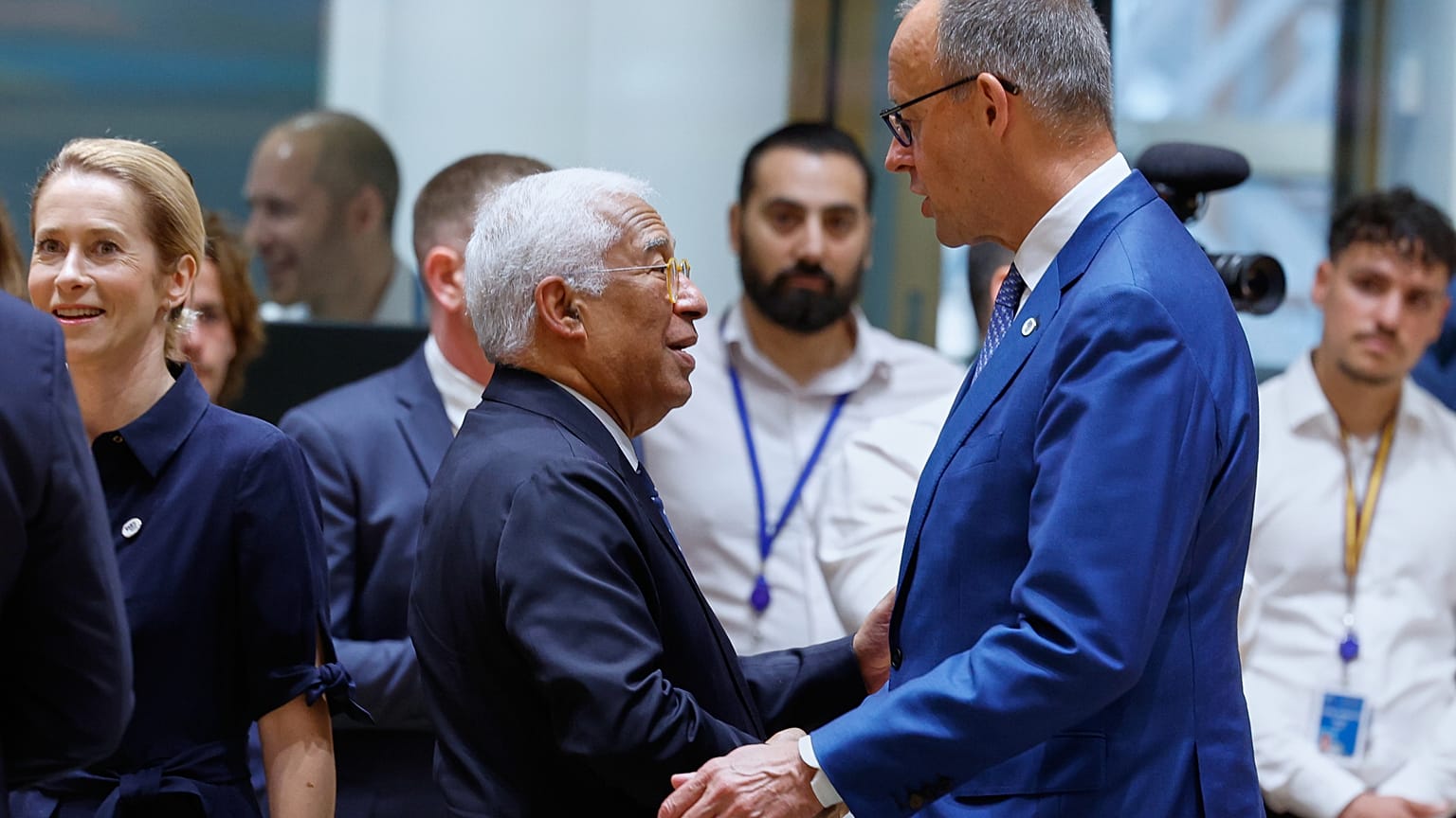 Germany's Chancellor Friedrich Merz, right, talks to European Council President Antonio Costa during a round table meeting at the EU summit in Brussels, Friday, June 19, 2026.