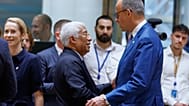 Germany's Chancellor Friedrich Merz, right, talks to European Council President Antonio Costa during a round table meeting at the EU summit in Brussels, Friday, June 19, 2026.