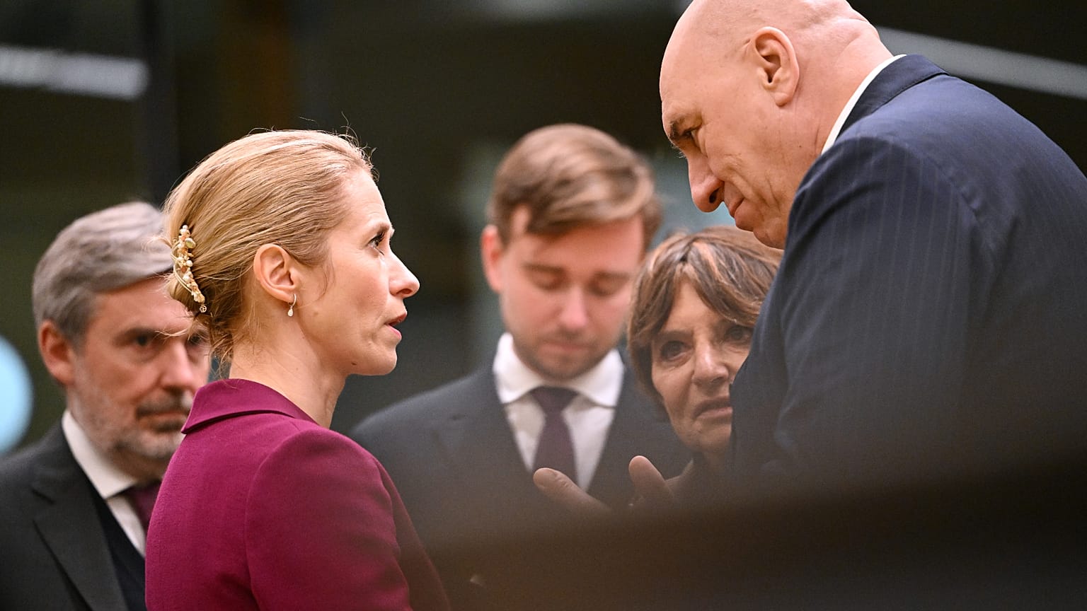 European Union foreign policy chief Kaja Kallas, left, speaks with Italy's Defense Minister Guido Crosetto during a meeting of European Union defense ministers.