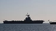 The Charles de Gaulle aircraft carrier is seen off the shore of the Faliro suburb, in Athens, Greece, Thursday, March 24, 2022.