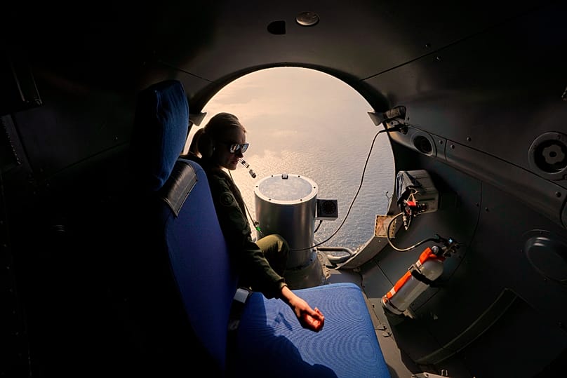 A crew member of a French Navy Atlantique-2 submarine hunter naval plane during a NATO military exercise over the Black Sea, 9 April, 2025