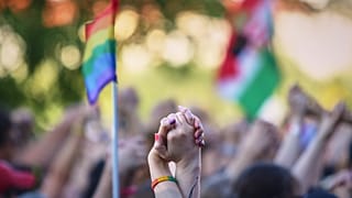 People hold hands during the Pride march in Budapest, 28 June, 2025