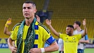Cristiano Ronaldo wears a Saudi flag scarf after Al-Nassr's victory over Neftchi Fergana in Riyadh, Saudi Arabia, 12 October 2026.