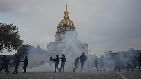 Police faces students after a march to protest against under-resourced schools in Paris, Tuesday Oct. 13, 2026.