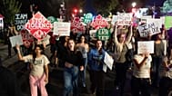 Demonstrators march to the White House from the Washington Monument during a "Stop Sexual Violence" protest Thursday, Oct. 8, 2026, in Washington.