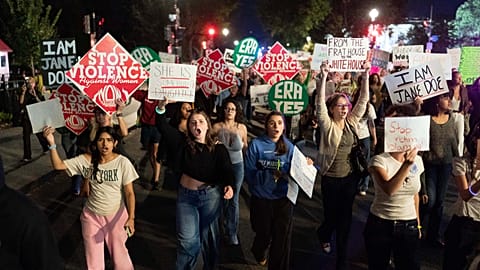 Demonstrators march to the White House from the Washington Monument during a "Stop Sexual Violence" protest Thursday, Oct. 8, 2026, in Washington.