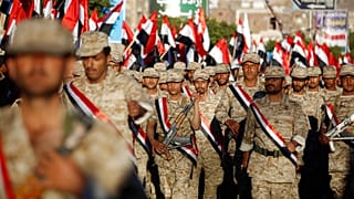 FILE: Uniformed Houthi fighters march during a rally commemorating the anniversary of South Yemen's independence from British colonial rule, in Sana'a, 30 November 2015