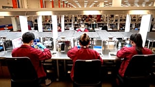 Workers making jewellery in Pandora's new factory