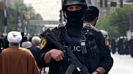 FILE: An Iranian police officer stands guard at Azadi (Freedom) St. in Tehran, 1 August 2024