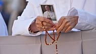 A nun holds a picture of Pope Leo XIV in St. Peter’s Square at the Vatican, 14 October, 2026