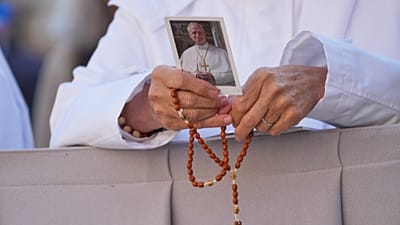 A nun holds a picture of Pope Leo XIV in St. Peter’s Square at the Vatican, 14 October, 2026
