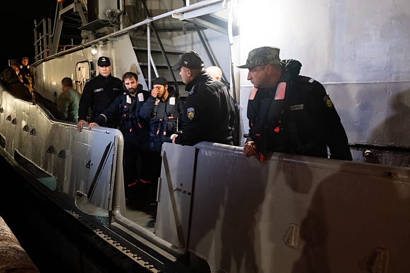 Four of the saved sailors from the HS Dignity seen on a Bulgarian Navy rescue tug en route to the port of Varna, 13 October, 2026