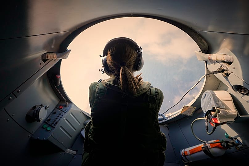 A crew member of a French Navy submarine hunter plane flying over the Black Sea, 9 April, 2025