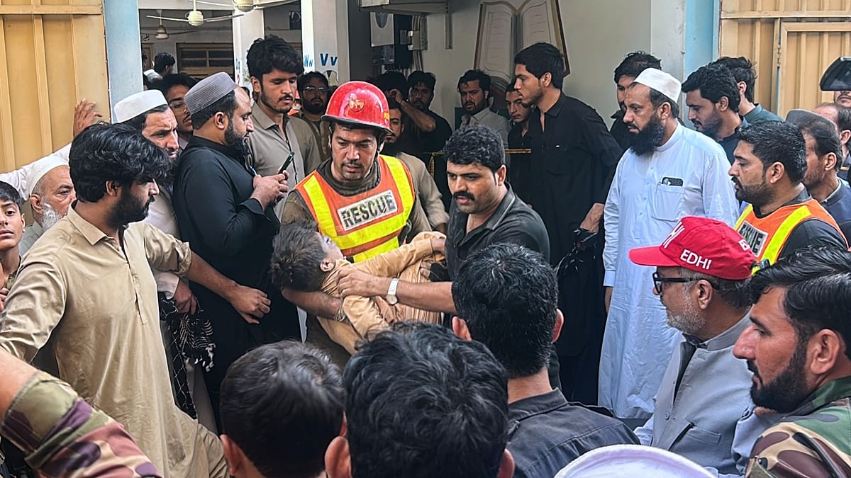 School roof collapse kills teacher and at least 17 children in northwest Pakistan
