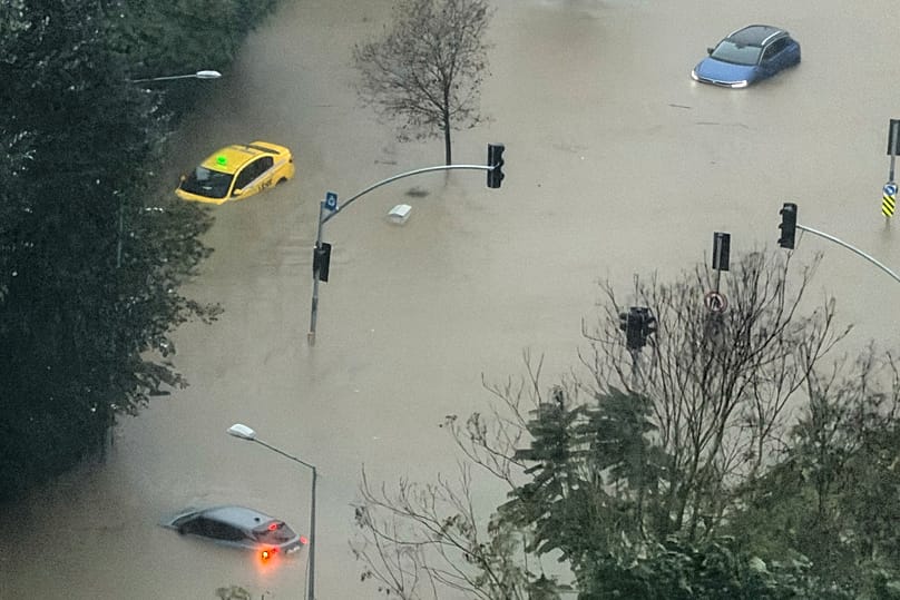 Vehicles are stranded in a partially flooded highway during heavy rains in Istanbul, 14 October, 2026