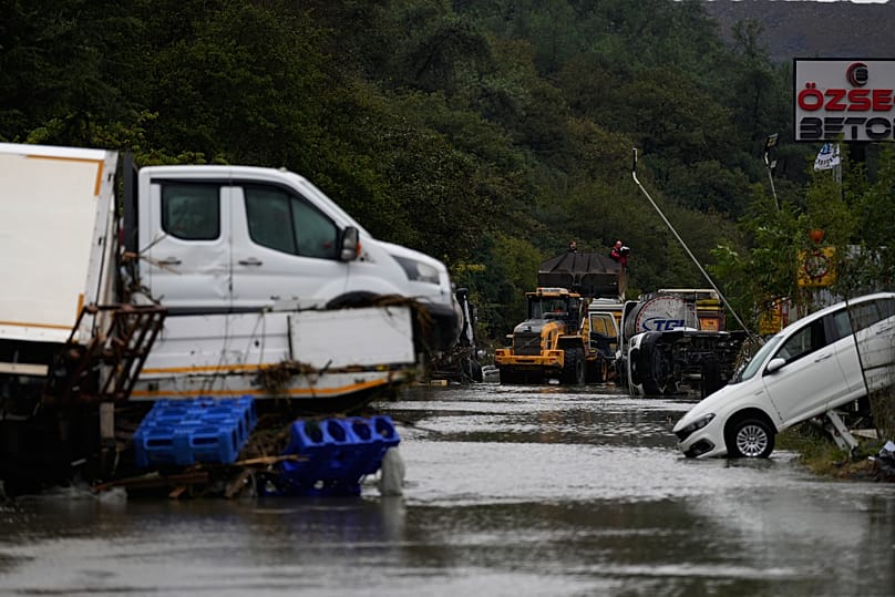 Vehicles lie scattered in the aftermath of floods caused by heavy rains in Istanbul, 15 October, 2026
