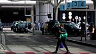 Passengers wait for airport taxis