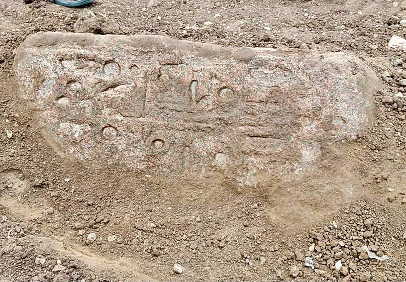 Ancient Egyptian inscriptions on a stone block recovered at the excavation site.
