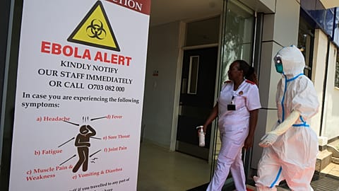Health workers and officials walk outside a Ebola isolation facility at The Nairobi Hospital, Kenya, Wednesday, Oct. 7, 2026.