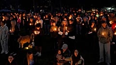 People gather for a candlelight vigil held in Drake Park in Bend, Ore., Thursday, Oct. 15, 2026